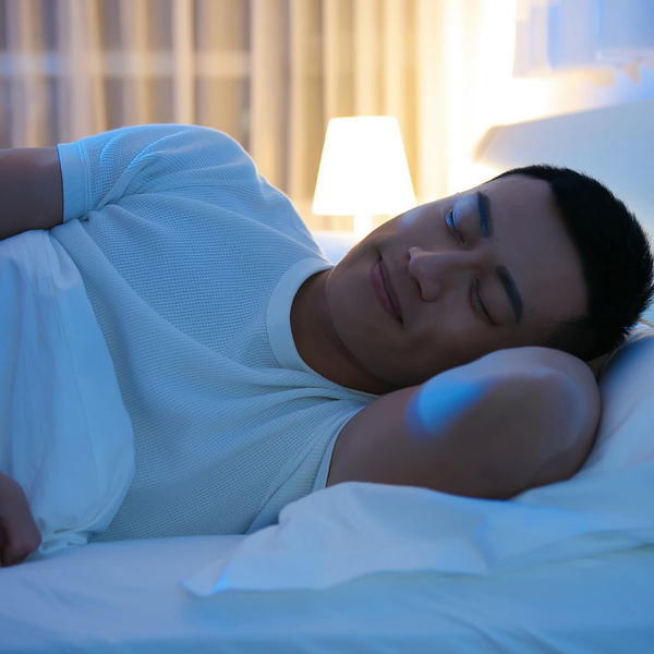 man smiling sleeping
