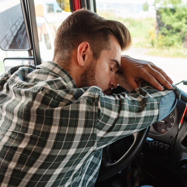 Man sleeping in his car